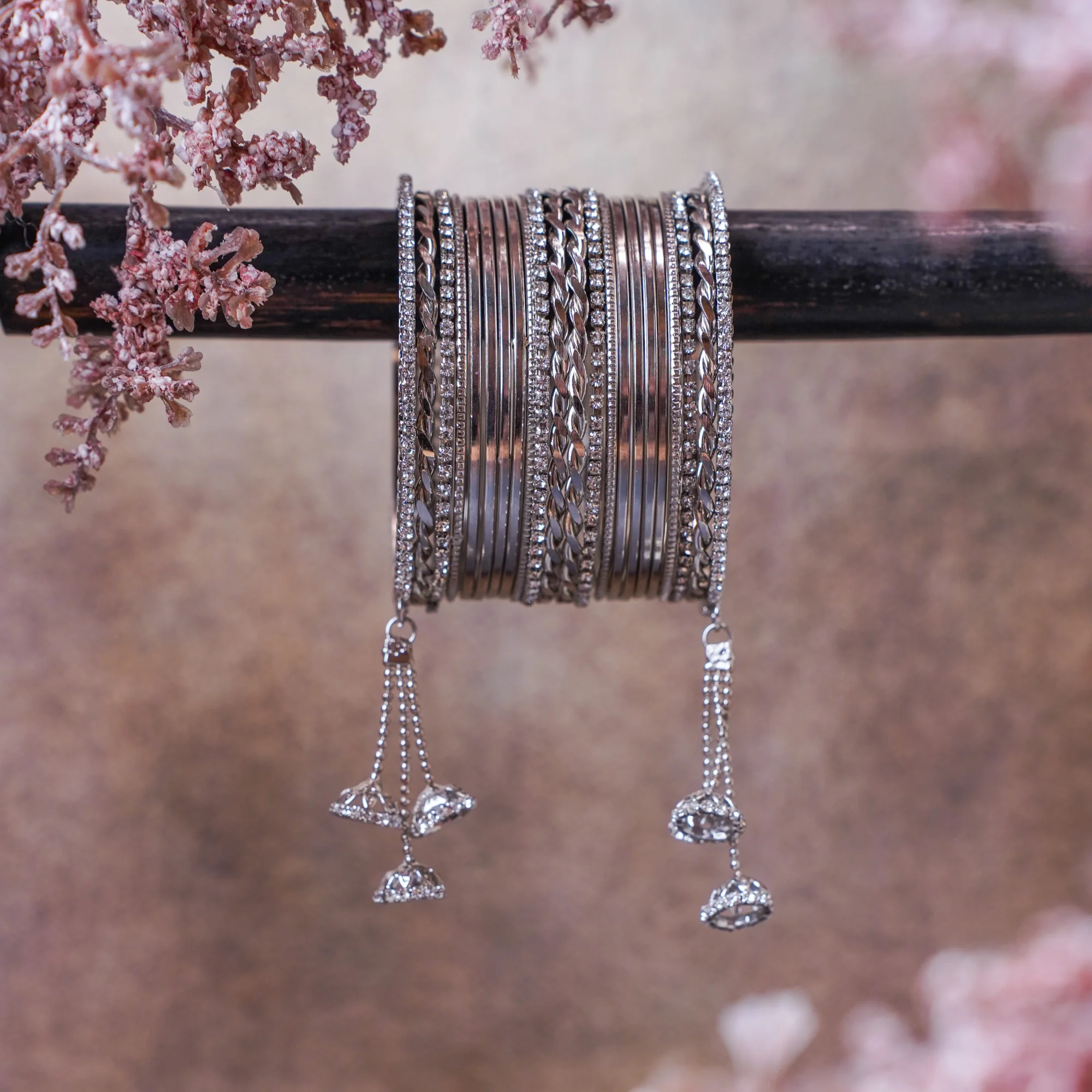 A beautiful silver-toned stack with premium metallic bangles, subtle sparkle and graceful dangling charms. Perfect for every day wear, festive occasions, and gifting.
Designed to suit all age groups, from younger styles to timeless classics.